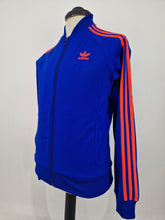 Load image into Gallery viewer, 2014 adidas Originals Dublin SST track top S Blue Orange
